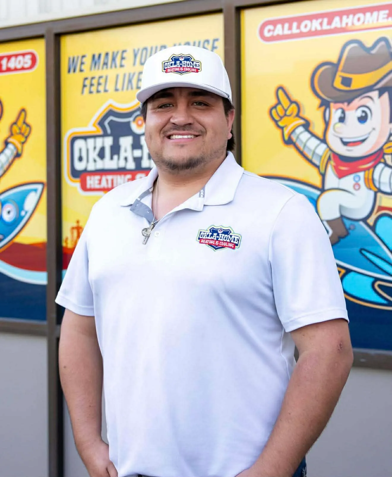 Cale Jones, owner of Okla-Home Heating & Cooling, in front of company storefront